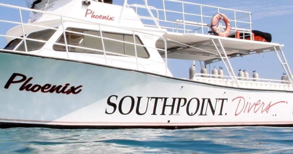 Dive boat named Phoenix from Southpoint Divers on water.